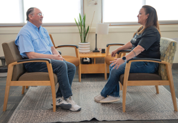 KCC Communications Director Gerry O'Brien, left, chats with Lady Badgers Soccer Coach Tiffany Poe.